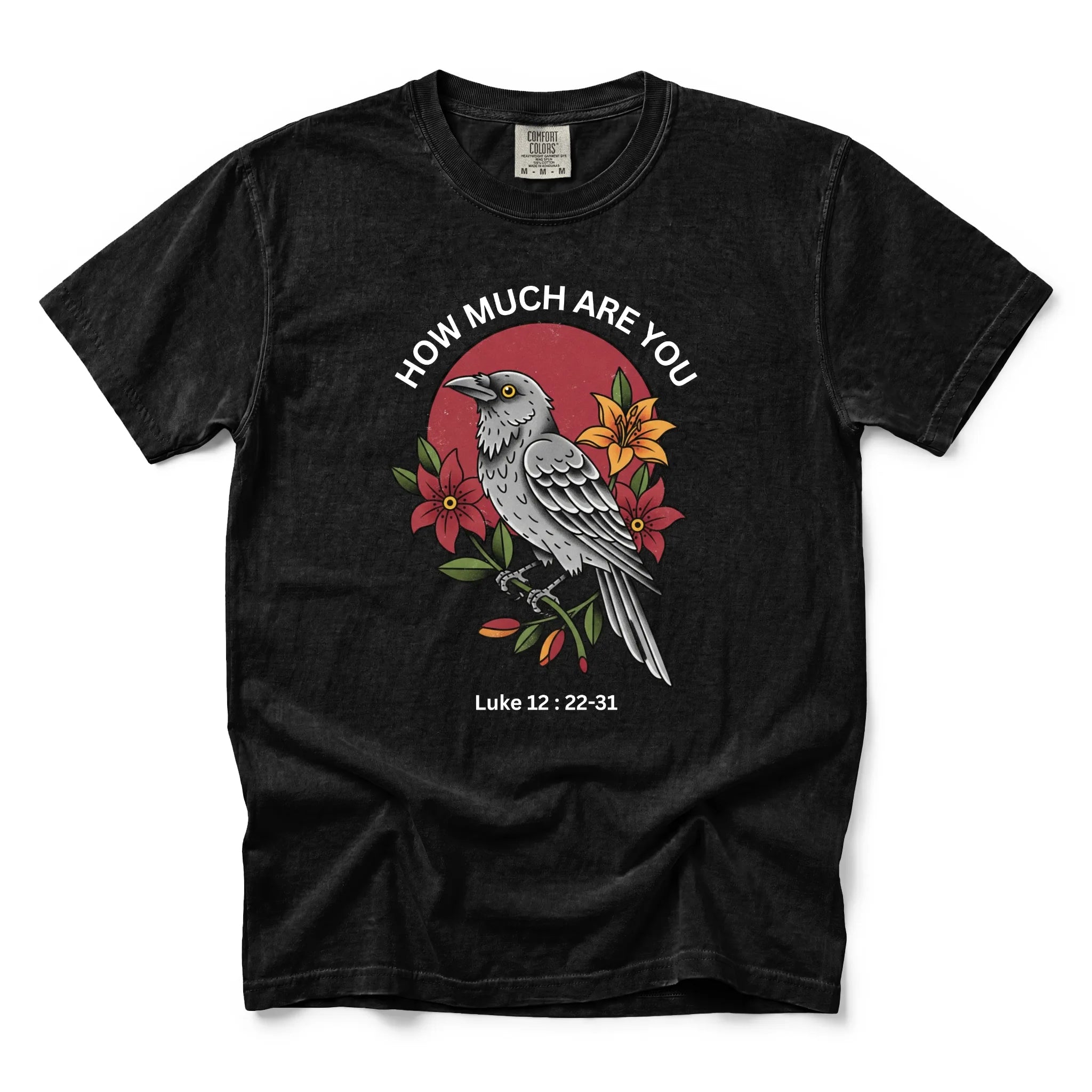 A black short-sleeve graphic t-shirt featuring a detailed illustration of a bird, red flowers, and the text 'HOW MUCH ARE YOU Luke 12:22-31' on the front, displayed against a clean white background.
