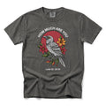A pepper short-sleeve t-shirt with a graphic print of a raven, red flowers, and the text 'HOW MUCH ARE YOU Luke 12:22-31' on a white background.